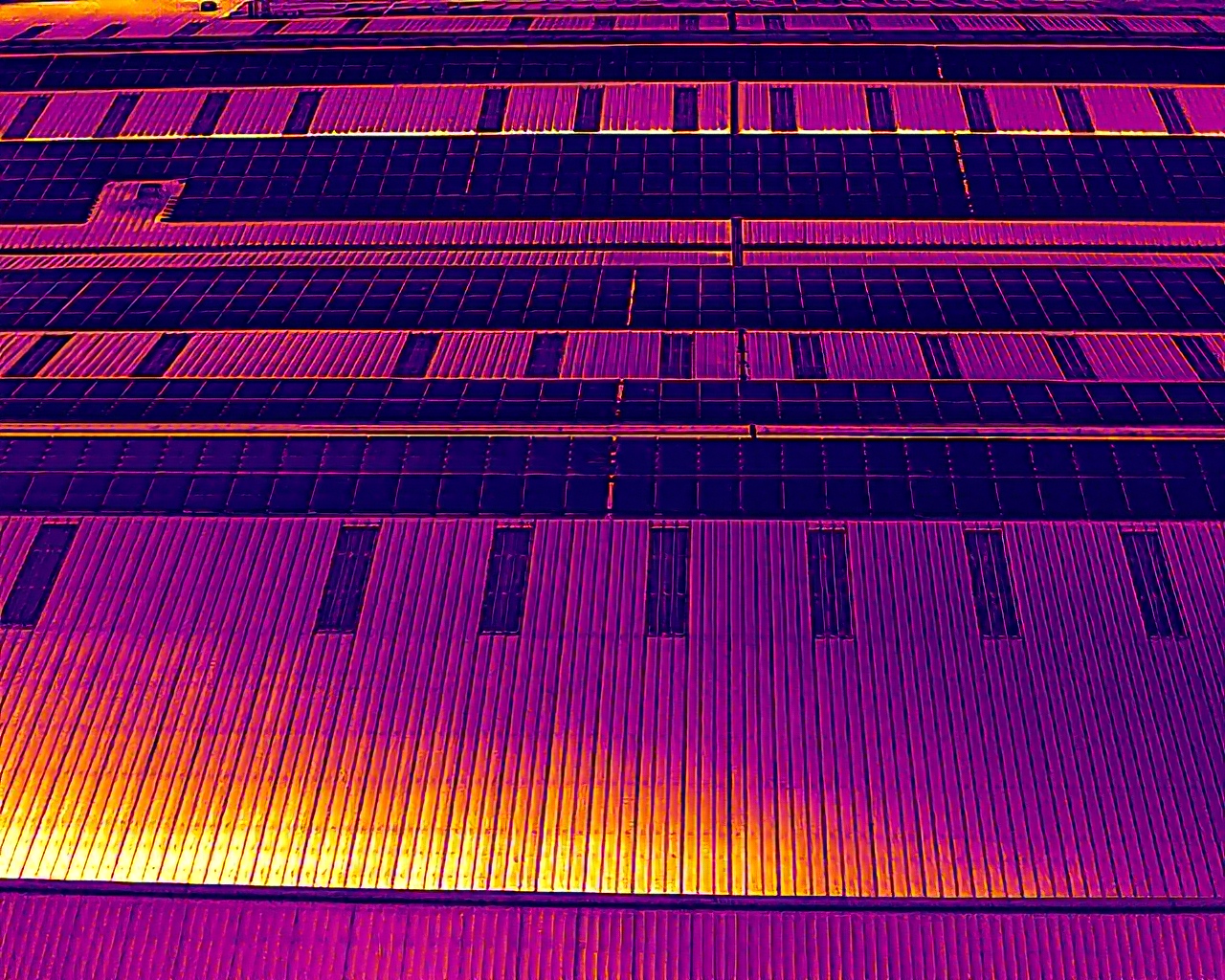 Thermal drone view of a commercial rooftop solar array from Renew-Able maintenance work